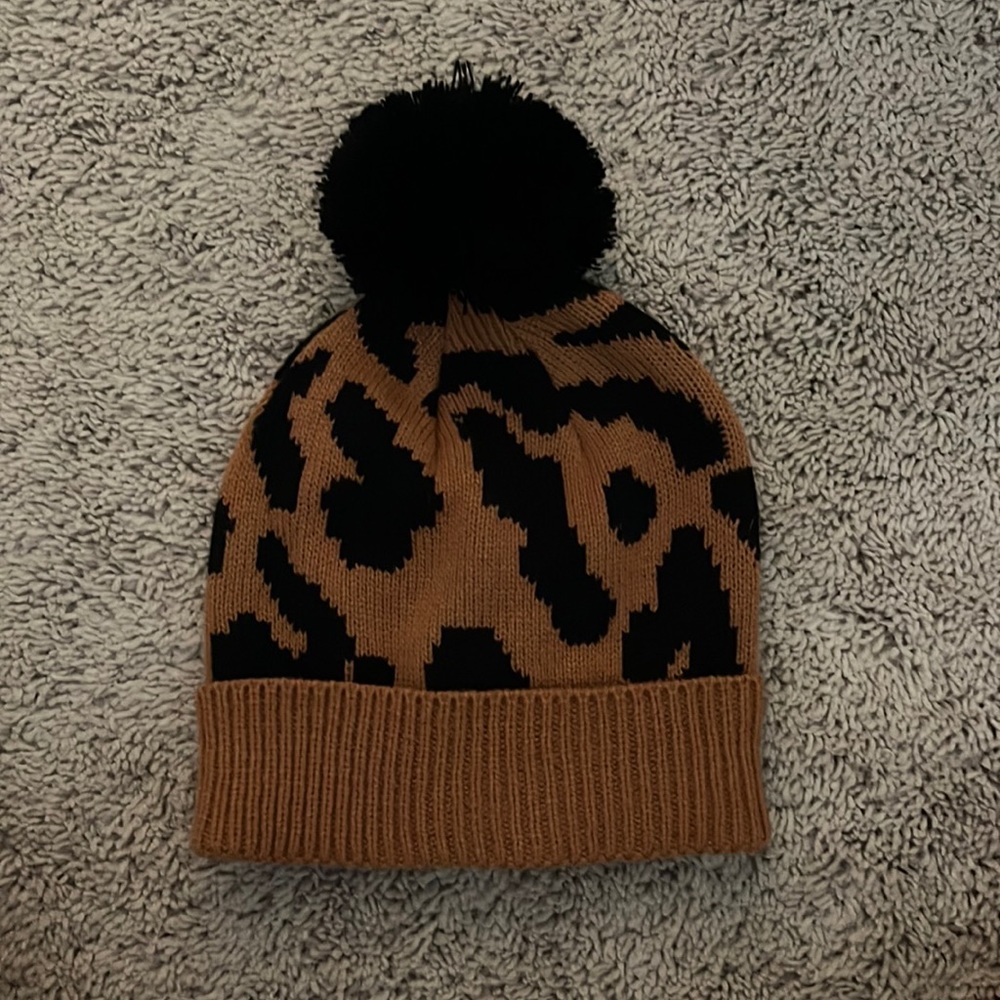 Printed beanie with cute fluffy pompom